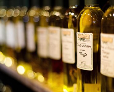 Bottles of cooking oil on a kitchen surface for comparing different edible oils