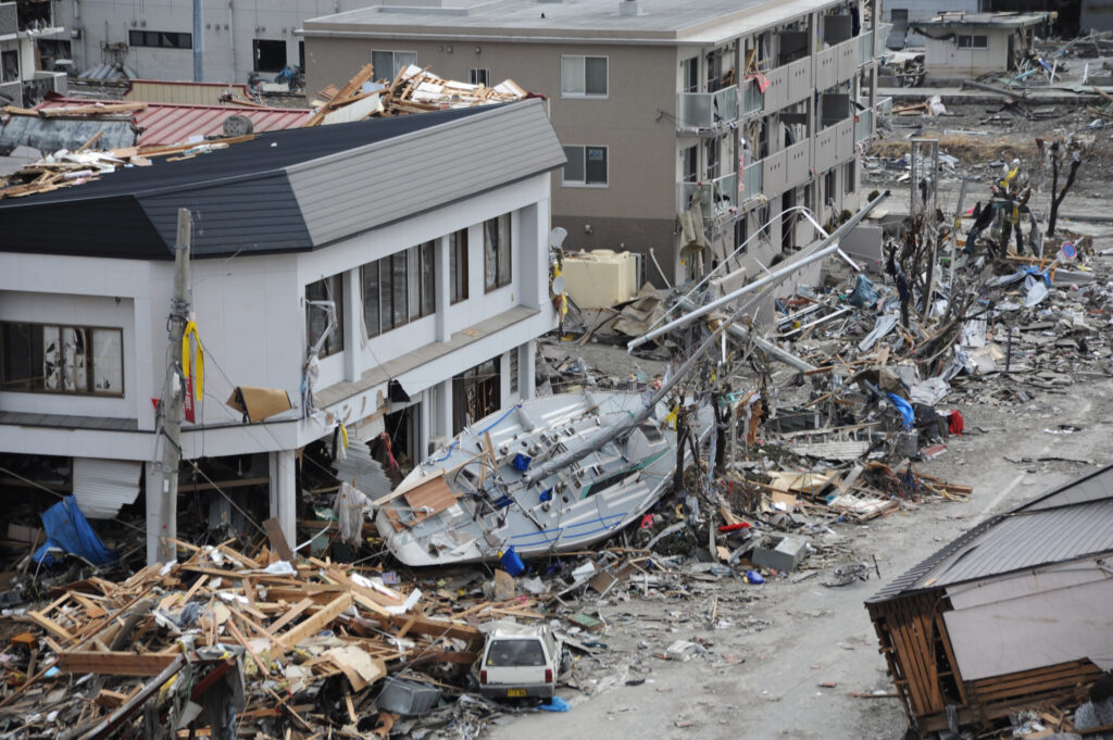 Fishing boat among debris in Ofunato, Japan, after the 2011 Tohoku earthquake and tsunami