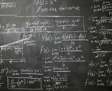 Calculus equations written on a blackboard for a lesson about the chain rule