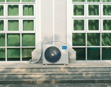 Outdoor HVAC unit with a fan and coil used to move heat between indoor and outdoor air