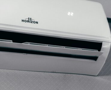 A wall-mounted air conditioner displaying a cool temperature setting