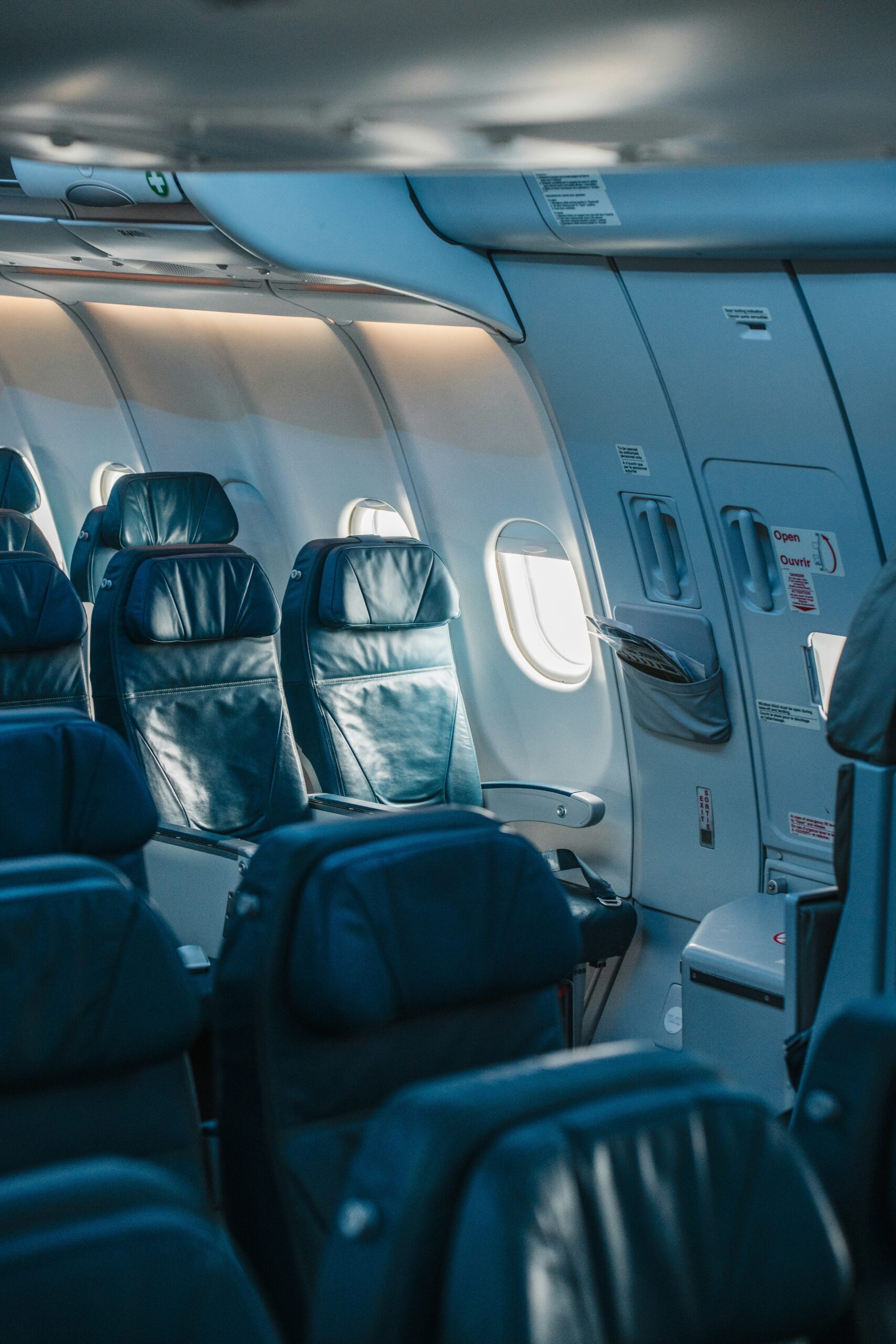 Rows of seats inside an airplane cabin during flight