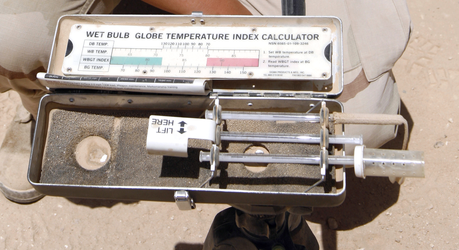 An analog wet bulb globe temperature meter used to measure outdoor heat stress.