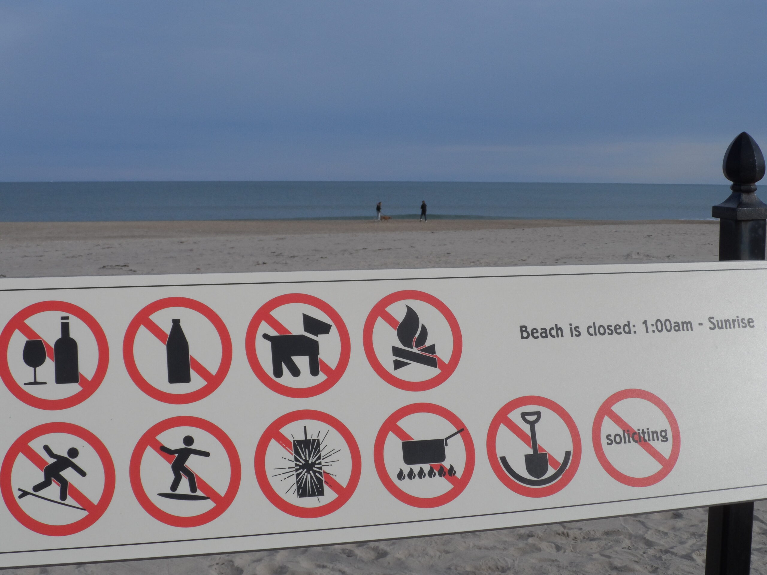Beach warning signs posted near the shore