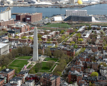 Aerial view of the Bunker Hill Monument and surrounding Charlestown neighborhood in Boston.