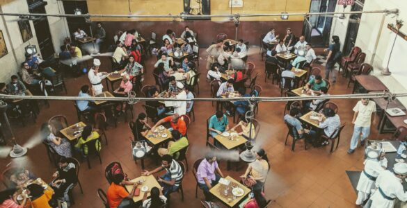 Students eating together in a campus dining hall while using a college meal plan