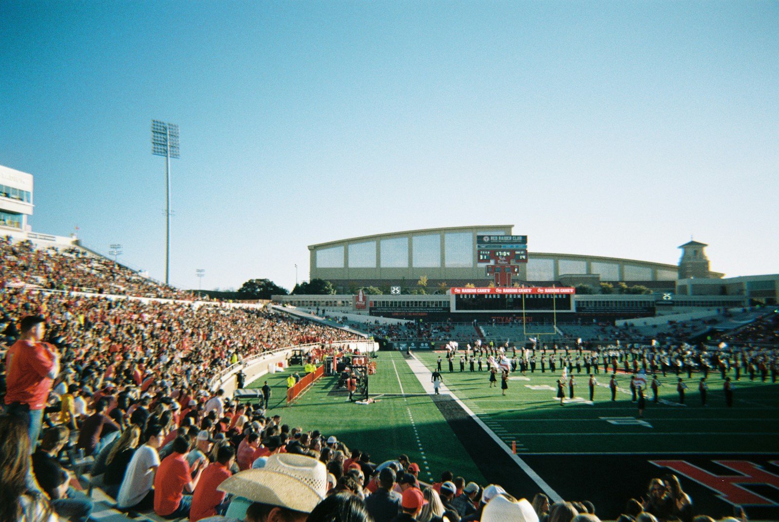 A packed college football stadium during a game