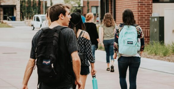 New college students walking across campus during summer orientation