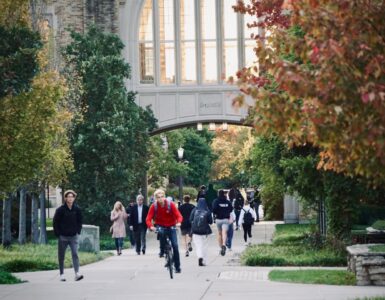 College students walking across campus before move-in and roommate planning