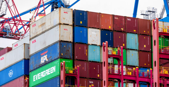 A container ship loaded with cargo at a port terminal