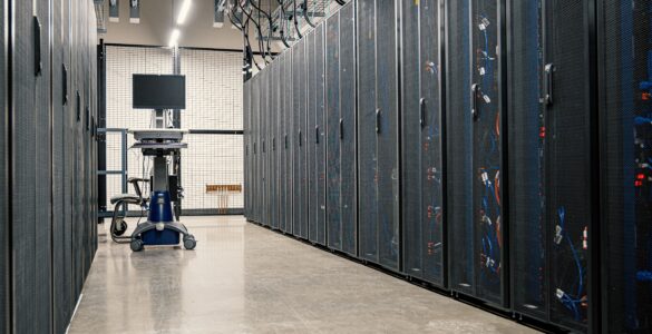 Rows of server racks inside a modern data center