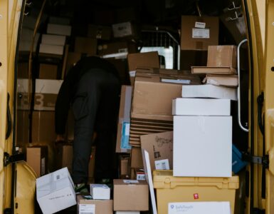 Cardboard packages stacked inside a delivery van for online orders crossing shipping networks