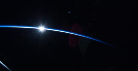 Sunrise over Earth's curved horizon photographed from orbit