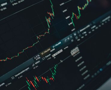 Financial graph lines on a screen showing changing expectations in a market.