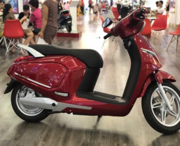 Electric scooter with its lithium-ion battery compartment visible