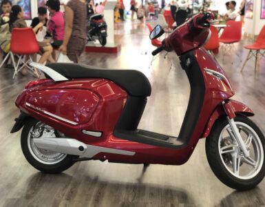 Electric scooter with its lithium-ion battery compartment visible