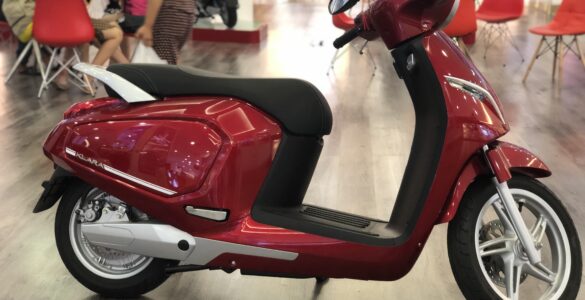 Electric scooter with its lithium-ion battery compartment visible
