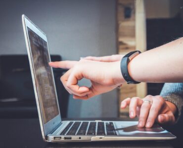 A student reviewing an online college form on a laptop