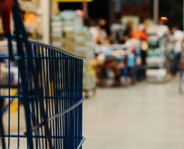 A supermarket aisle where shoppers can compare packaged foods by price and Nutrition Facts labels