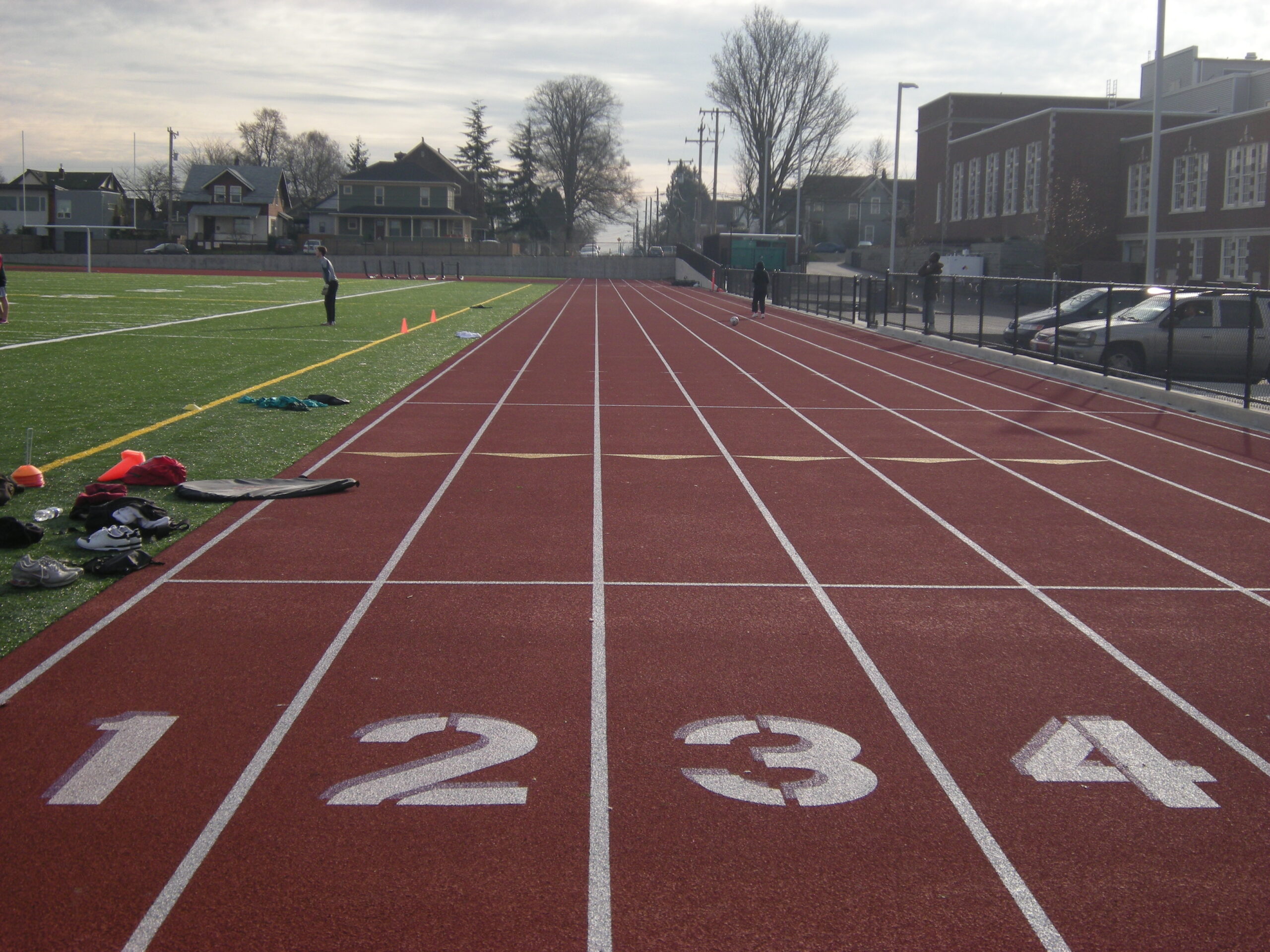 A high school running track with numbered lanes used for athletic training and competition