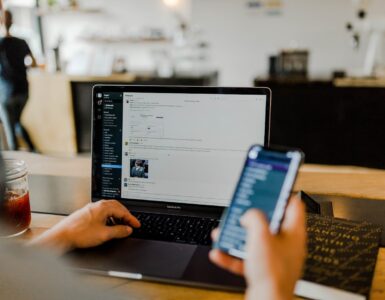 A person using a laptop with a secure connection, representing how a VPN encrypts traffic on public networks