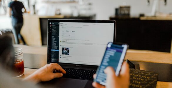 A person using a laptop with a secure connection, representing how a VPN encrypts traffic on public networks