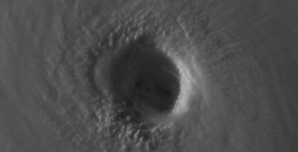 Close satellite view of a hurricane eye and surrounding cloud bands