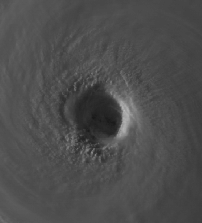 Close satellite view of a hurricane eye and surrounding cloud bands