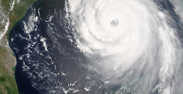 Satellite image showing the eye and cloud bands of a large hurricane over the Gulf of Mexico.