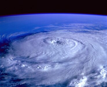 A hurricane seen from space, showing the spiral structure that forecasters track and name.