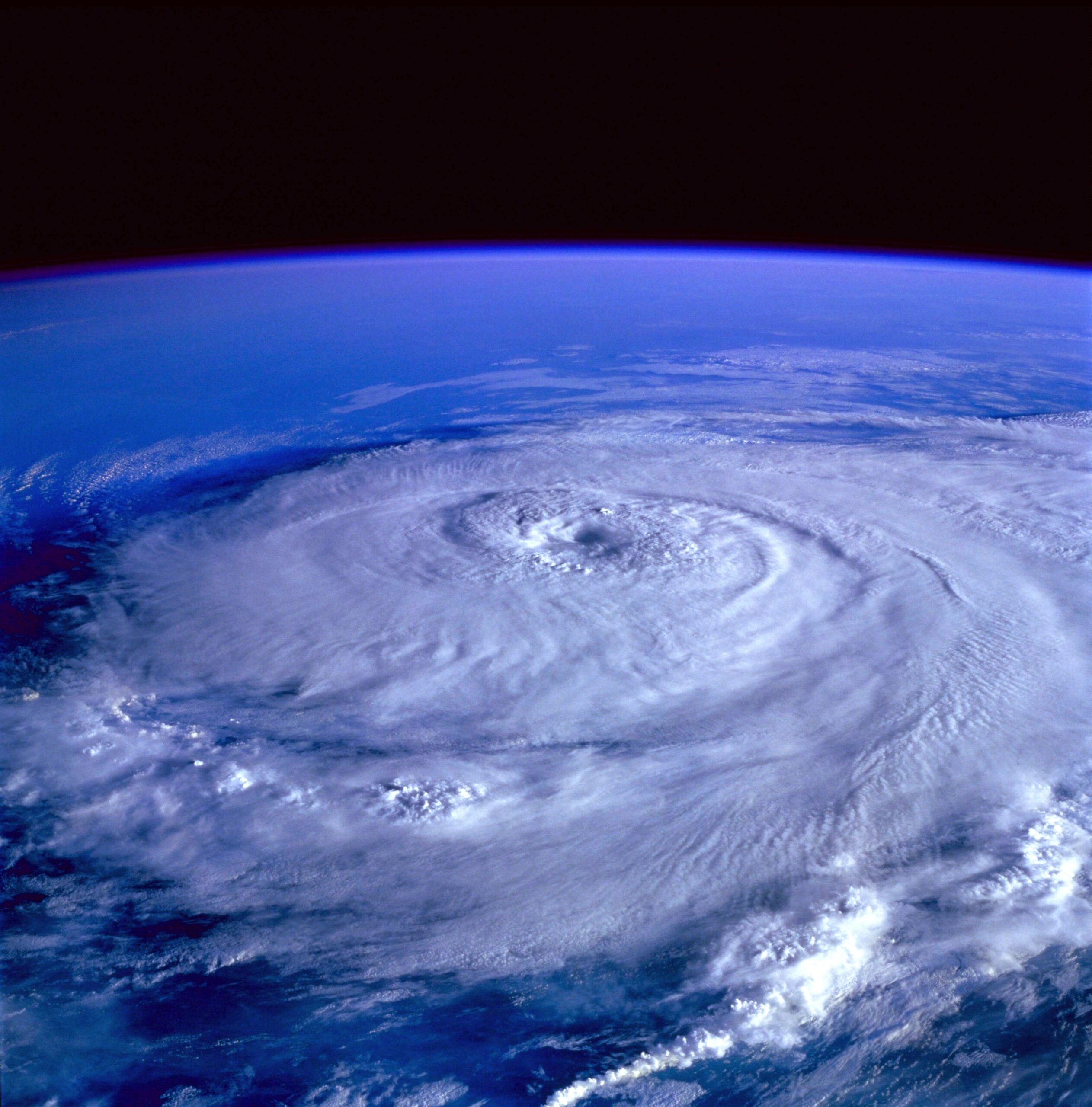 A hurricane seen from space, showing the spiral structure that forecasters track and name.