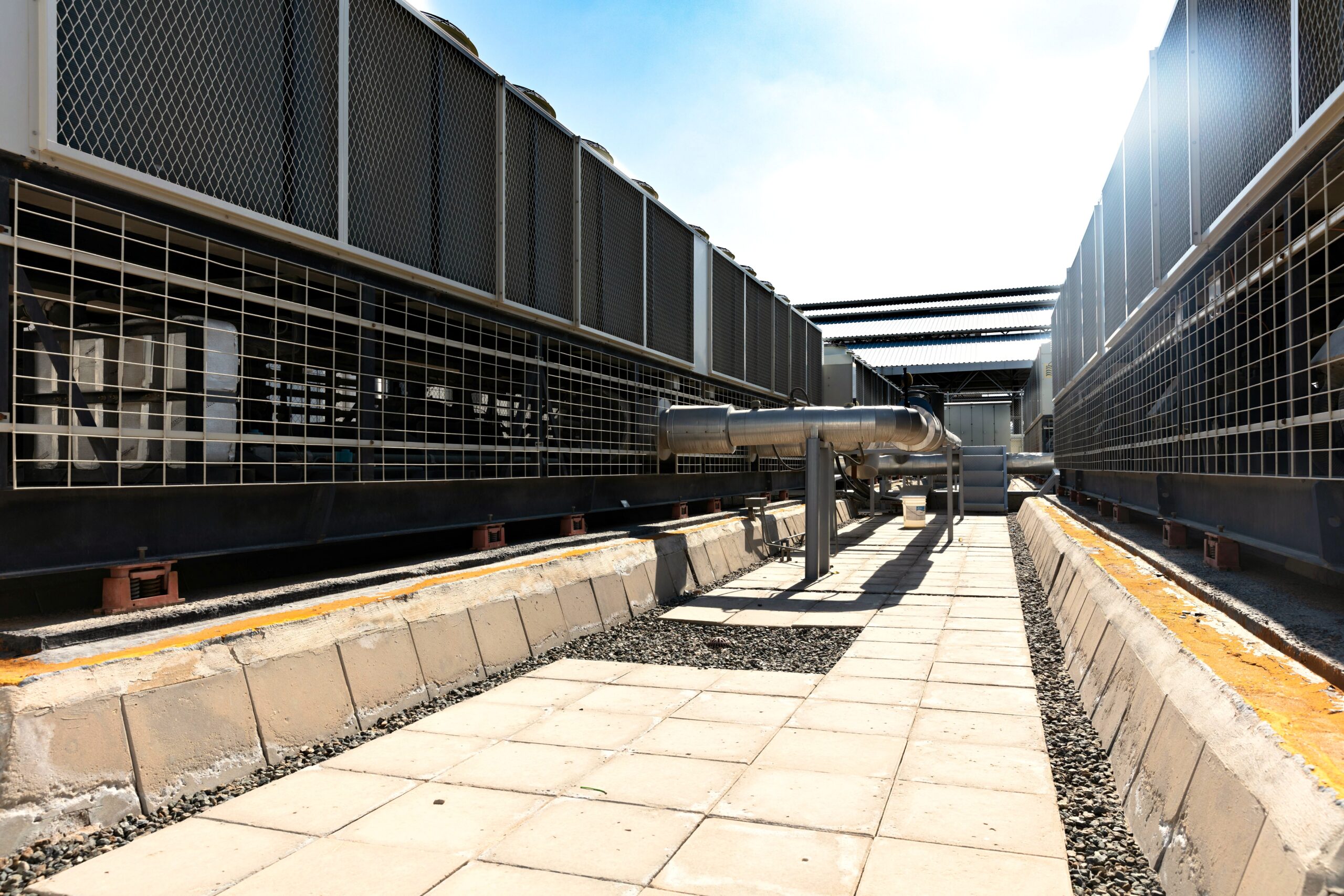 Large cooling equipment and metal piping used to move heat away from machinery