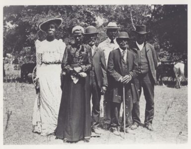 A group gathered outdoors for a Juneteenth Emancipation Day celebration in Texas in 1900.