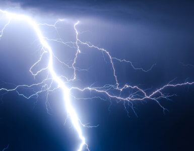 A cloud-to-ground lightning strike during a thunderstorm, the kind of flash lightning detection networks can locate.
