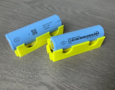 Two cylindrical lithium-ion battery cells used in rechargeable devices