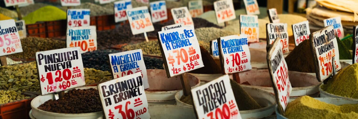 Price tags displayed at a market stall showing how prices guide everyday choices.