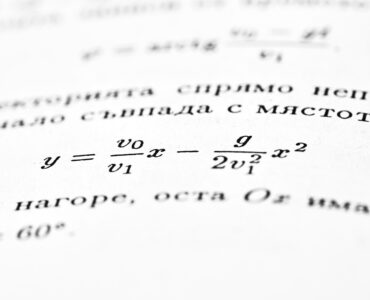 A close-up of mathematical equations used to connect changing quantities in a calculus problem.
