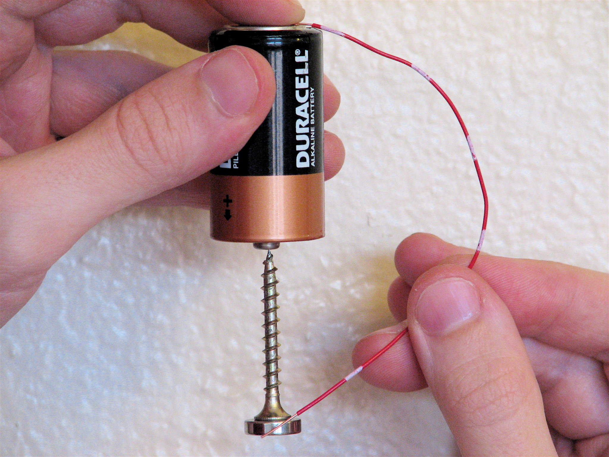 A simple homopolar motor using a battery, wire, screw, and neodymium magnet