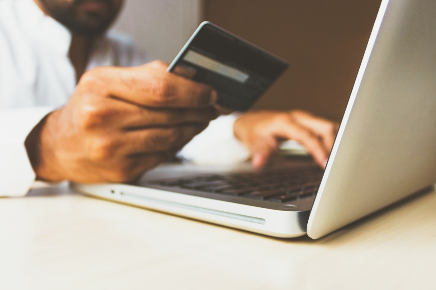 A credit card and laptop representing online payment security