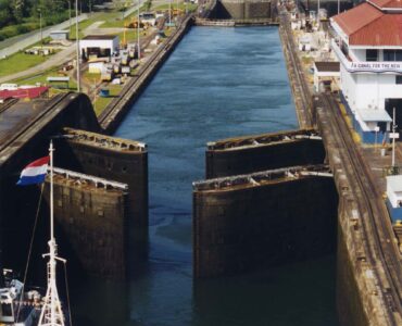 A ship approaches open gates at the Gatun Locks of the Panama Canal.