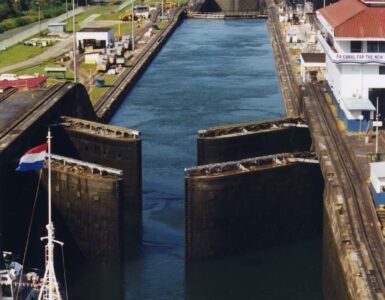 A ship approaches open gates at the Gatun Locks of the Panama Canal.