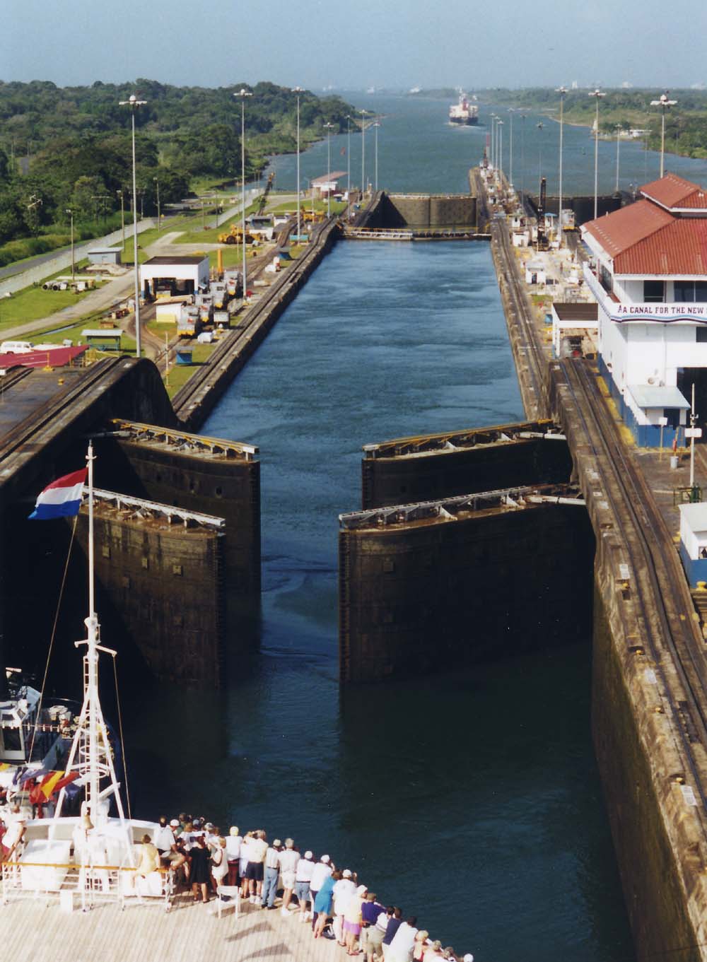 A ship approaches open gates at the Gatun Locks of the Panama Canal.