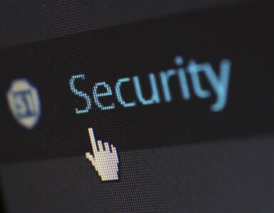 A padlock resting on a computer keyboard to represent password security.