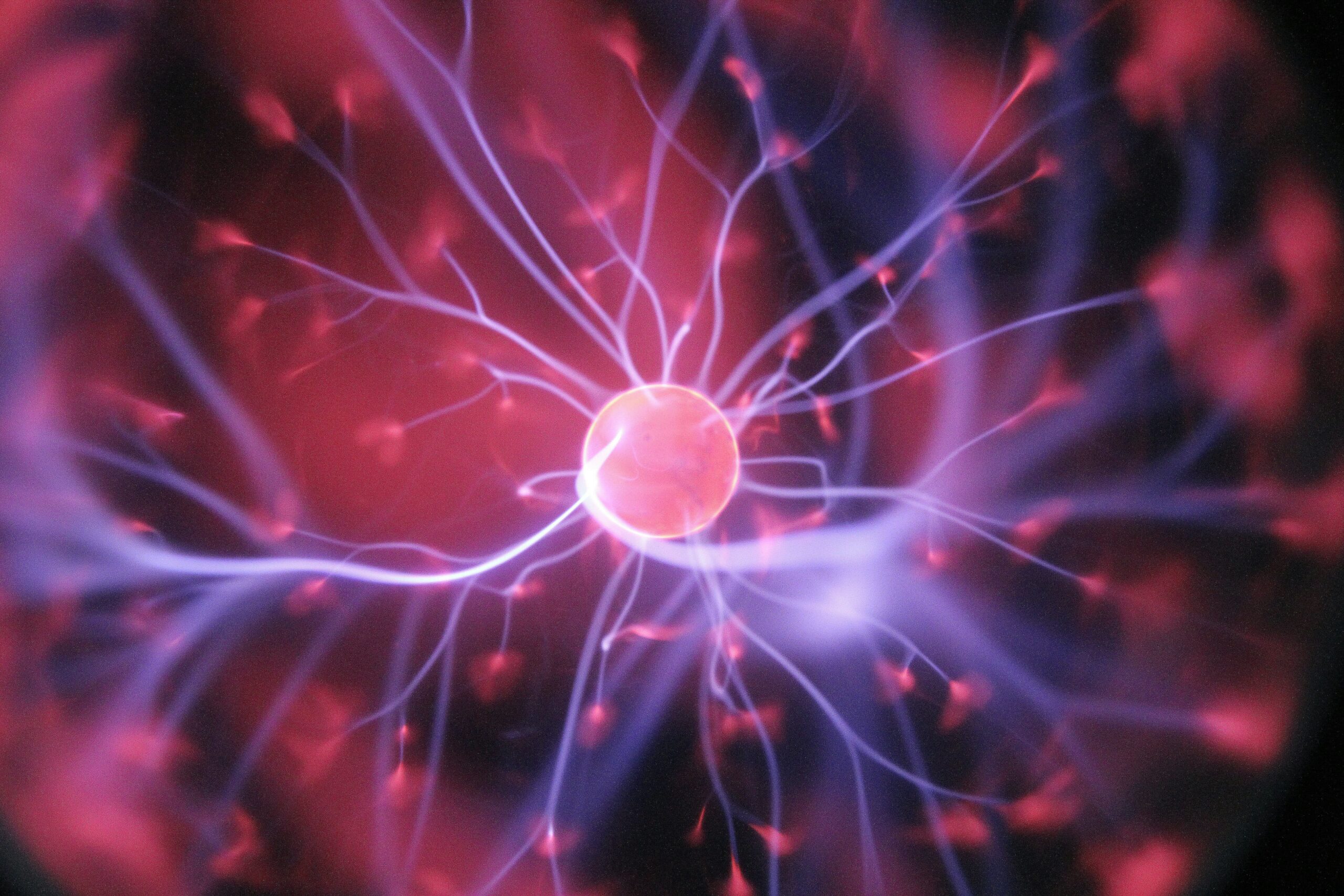 A plasma globe with pink and violet glowing arcs