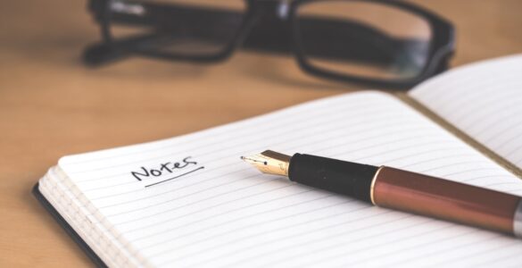 A notebook and pen used to prepare notes for a college recommendation letter request.