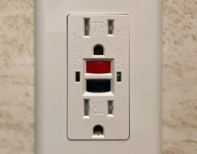 A residential GFCI outlet with test and reset buttons