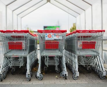 Rows of shopping carts at a store entrance during back-to-school shopping season