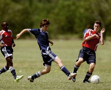 Soccer ball on a green field before a tournament match