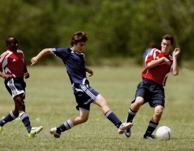 Soccer ball on a green field before a tournament match
