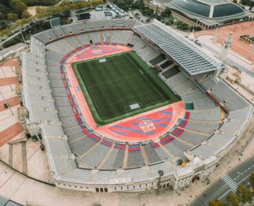 Aerial view of a soccer stadium and pitch from above.